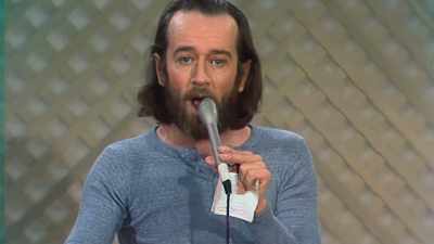 (MIMICS OVERLAPPING
RADIO CHATTER) - George Carlin's American Dream