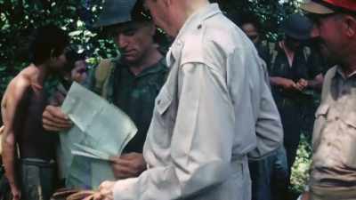 Most, they learn, are
dug in further inland. - The Pacific War in Color