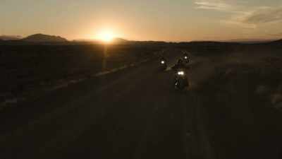 (motorcycles rumbling) - Trackers