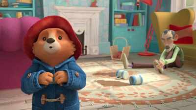 Mr. Curry
is putting up a high drinks shelf, - The Adventures of Paddington