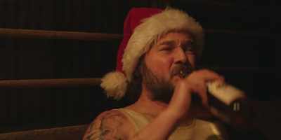 -(MUSIC DARKENS)
-(GIBBERS) - A Sunburnt Christmas
