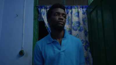 [music on TV] - The Burial of Kojo