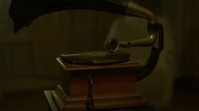 [music playing over gramophone] - House of the Witch