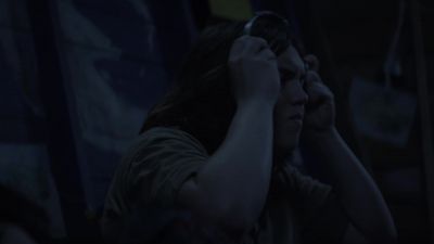 [Music plays through headphones] - The Walking Dead: World Beyond