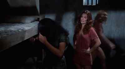 - Must be awfully hard
to keep your hair neat - Women in Cages