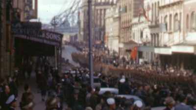 Narrator: CITIES LIKE BRISBANE
ARE OVERRUN BY AMERICANS. - The Pacific War in Color