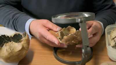 NARRATOR: Examining
the shattered skull, - Lost Treasures of Rome