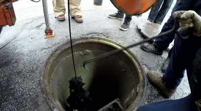 [narrator]  First, the team
must take off the layer - Sewer Divers