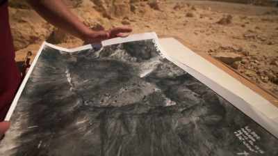 Narrator:
Guy uses the photograph - Dead Sea Scrolls: The Doomsday Prophecy