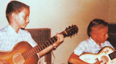 [narrator] It wasn't long before
Jimmie was learning songs, - Jimmie & Stevie Ray Vaughan: Brothers in Blues