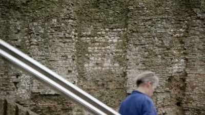 Narrator:
It's an ancient stone wall. - Searching for Secrets