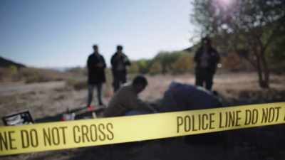 NARRATOR: Officers fromn the
Utah County Sheriff's Office - Buried In The Backyard