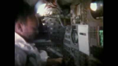 Narrator: On earth, cameras
record recovery preparations - Apollo: The Forgotten Films