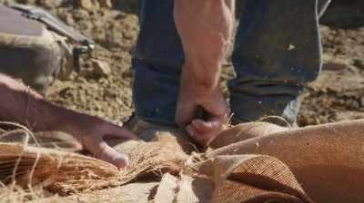 Narrator: PLASTER-SOAKED BURLAP
WILL CREATE A HARD SHELL, - Dino Hunters