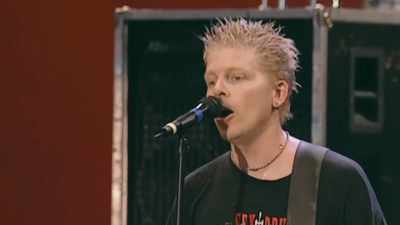 NARRATOR: "Rock on!" - Woodstock 99: Peace Love and Rage