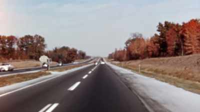 Narrator: THE ROAD IS DESIGNED
WITH AS FEW CURVES AS POSSIBLE - America in Color