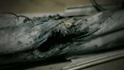 Narrator: THESE CORRODED CABLES SMOLDER, - Strange Evidence