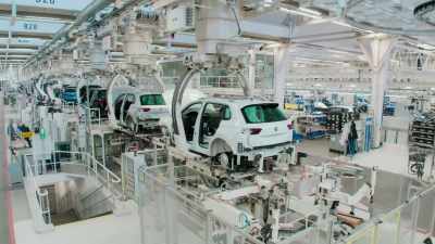 NARRATOR: Together,
robots and humans fix chassis to bodies, - Europe From Above
