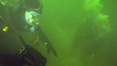 NARRATOR:
While diving in Lake Michigan, - The Curse of Civil War Gold
