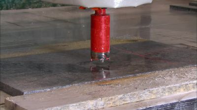 NEXT, A DRAIN HOLE IS PUNCHED - How It's Made