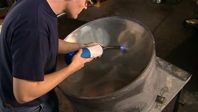 NEXT, HE BURNS THE BORDER OF
EACH NOTE WITH A BLOWTORCH. - How It's Made