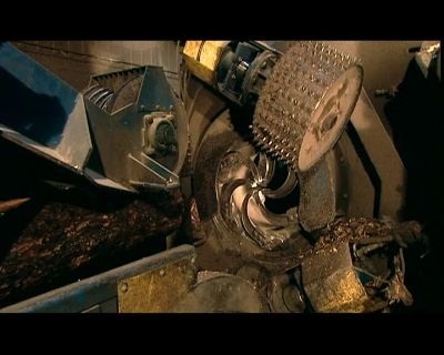 NEXT THE LOGS
GO THROUGH THE DEBARKER, - How It's Made