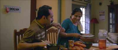 No No you sit,  Honey, get Mom a poori. - Kumbalangi Nights