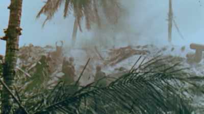 Norm Hatch keeps
his camera rolling. - The Pacific War in Color
