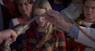 Now I'm helping Dr. Stoner
feed the snake using a pressure gun, - Sssssss