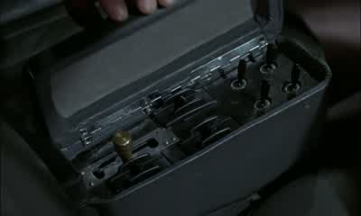 Now this one I'm particularly keen about You see the gear lever hereNow if you take the top offyou'll find a little red buttonWhatever you do don't touch it And why notBecause you'll release this section of the roofand engage and fire the passenger - Goldfinger