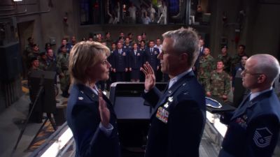 Now raise your right hand and repeat after me. - Stargate SG-1