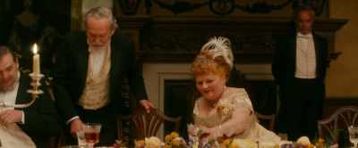 Now, sit down here
and have something warming. - Downton Abbey: A New Era