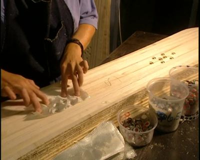 NOW THEY MUST SECURE
THE ALUMINUM INSERTS, - How It's Made