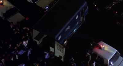 OFFICER:
All right, move it. Everybody in. - Badge 373