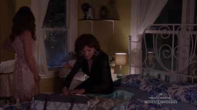 Okay, so you wrap it like this, - A Bundle of Trouble: An Aurora Teagarden Mystery
