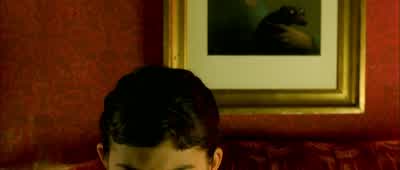 On a sparkling evening in July,while on the beaches, holidaymakersrelax in the new-found sun, and in Paris the sweltering crowds gaze at the first burstsof the traditional fireworks. Amélie Poulain,godmother of outcasts, Madonna of the unloved, finally - Amélie