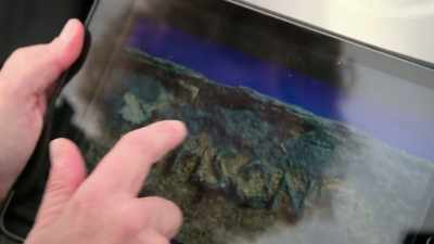 On board the dive boat, she
analyses an inscribed lead pipe - Lost Treasures of Rome