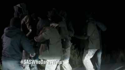 On your knees! Heads down!
DOGS BARK - Celebrity SAS: Who Dares Wins