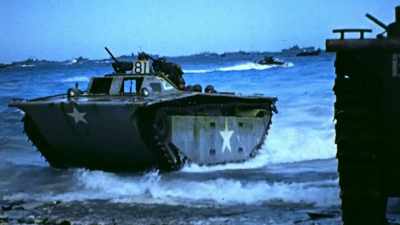 On the beach,
resistance is light. - The Pacific War in Color