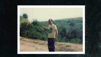 On the fire road,
pointing to the steep ravine. - The Toolbox Killer