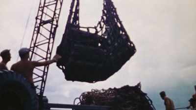 On the first day,
107,000 tons come ashore. - The Pacific War in Color