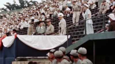 ONCE, SHE EVEN THROWS OUT
THE FIRST PITCH. - The Pacific War in Color