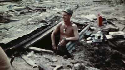 ONE EVEN BUILDS
HIS LIVING QUARTERS - The Pacific War in Color