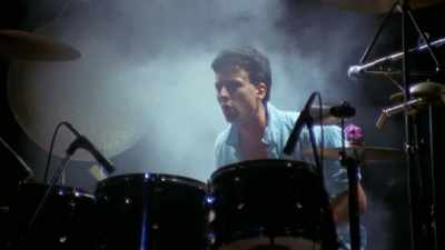 ["Only the Strong" playing] - Midnight Oil: The Hardest Line