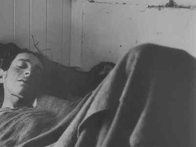 Others bunk together to keep
their frail bodies warm. - Nazi Concentration Camps