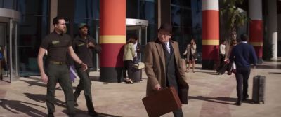 Our man is en route to exit.
Main gate departures. Two b's in pursuit. - Operation Fortune: Ruse de Guerre