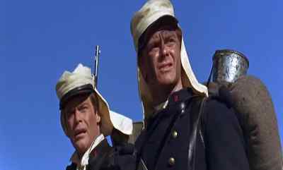 Our military escort is still with us. - Beau Geste