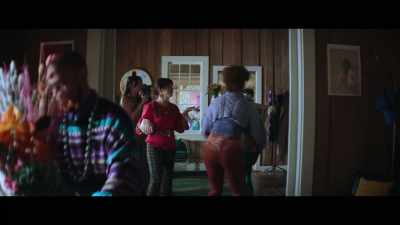 [overlapping chatter]
[tinny music playing] - The Young Wife