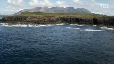 Overshadowed by the brooding
and dramatic Cuillin mountains, - Scotland from the Sky