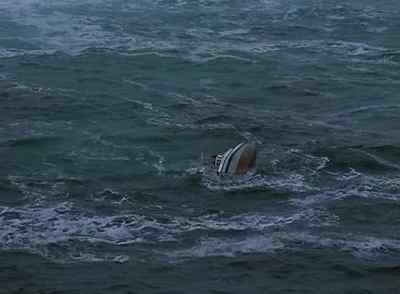 Overturned hull in sight
and there appears to be movement.  - Far from Home: The Adventures of Yellow Dog